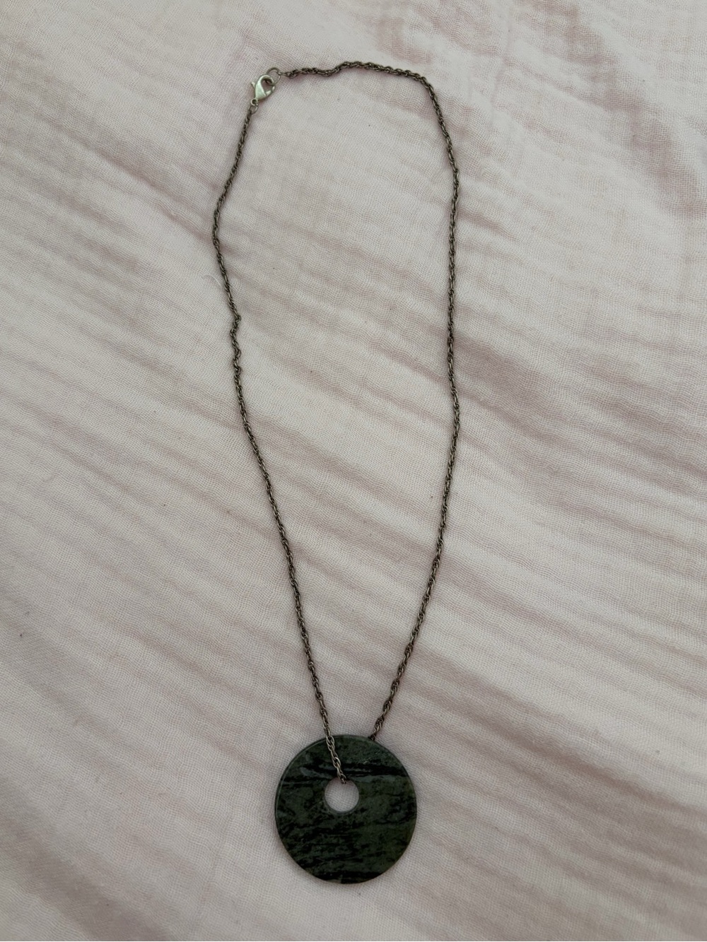 green flat stone pendant